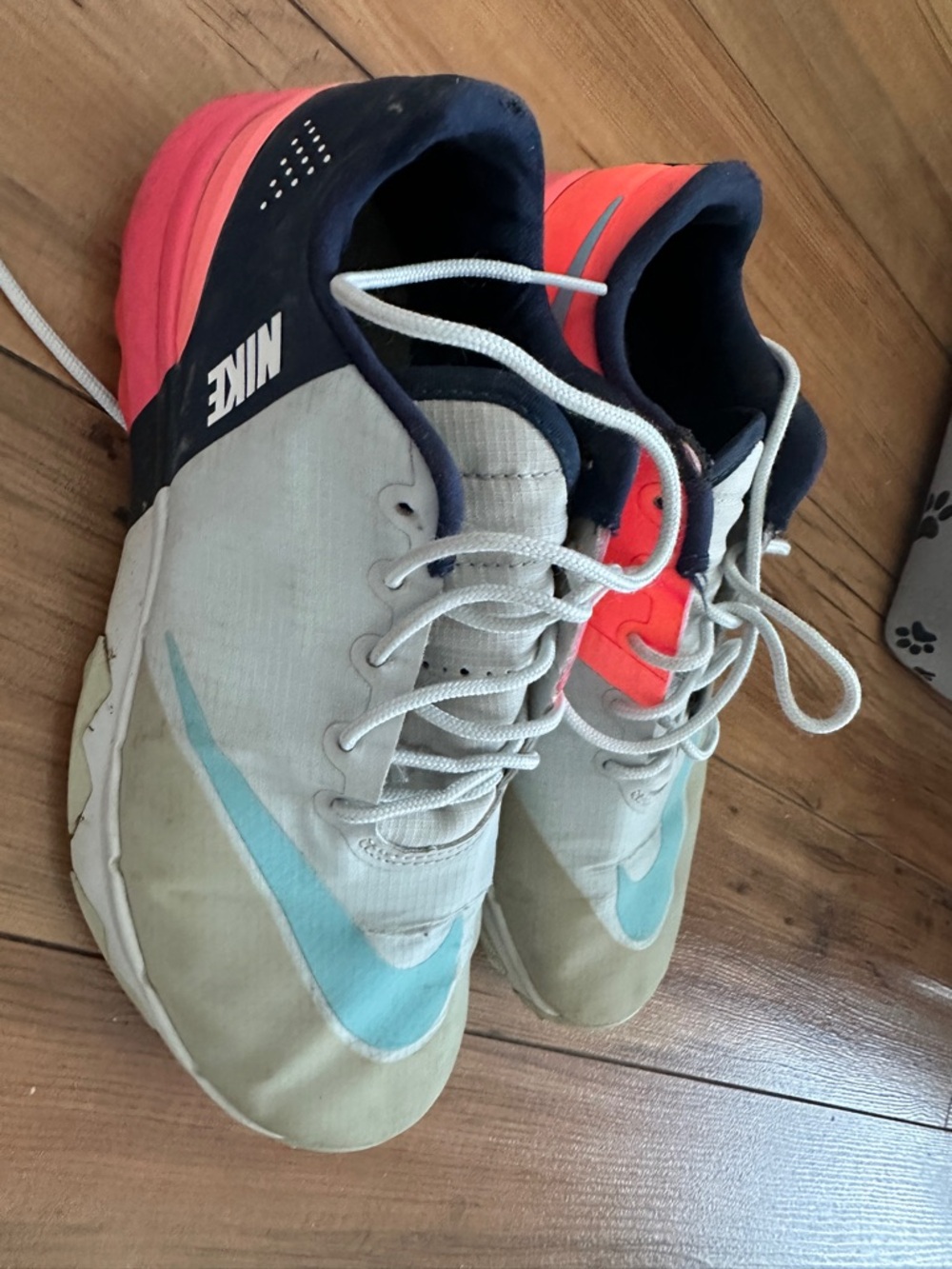Nike Beige and Coral Athletic Sneakers with Light Blue Swoosh
